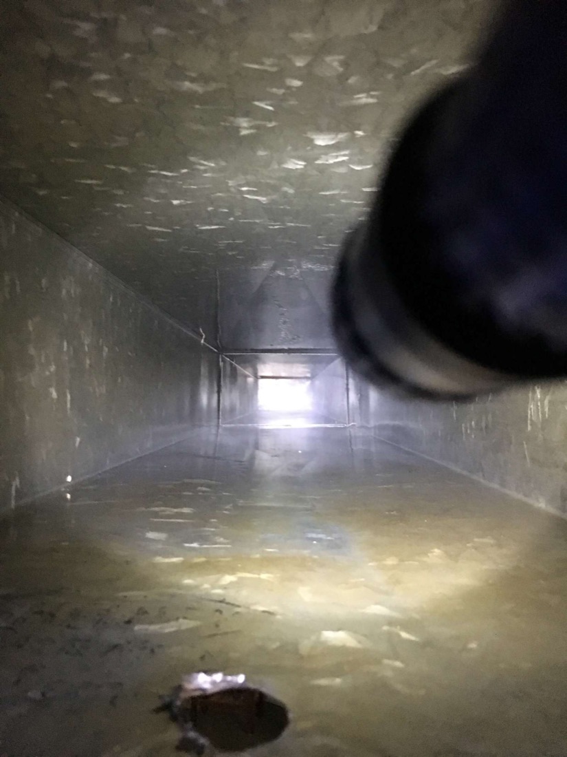 The same residential sheet-metal air duct after debris removal