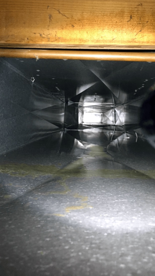 The same sheet-metal air duct after construction debris was removed